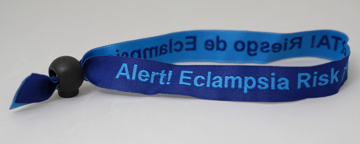 Blue Band with bungee and embroidered with the phrase, "Alert! Eclampsia Risk"