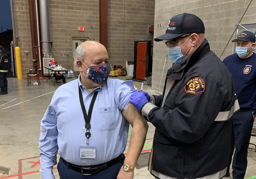 Dr. Velazquez getting vaccinated at the EMS drive-thru vaccination clinic